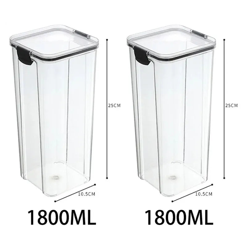 A collection of transparent storage containers filled with various dry foods like pasta, beans, nuts, and cereals on a wooden surface.