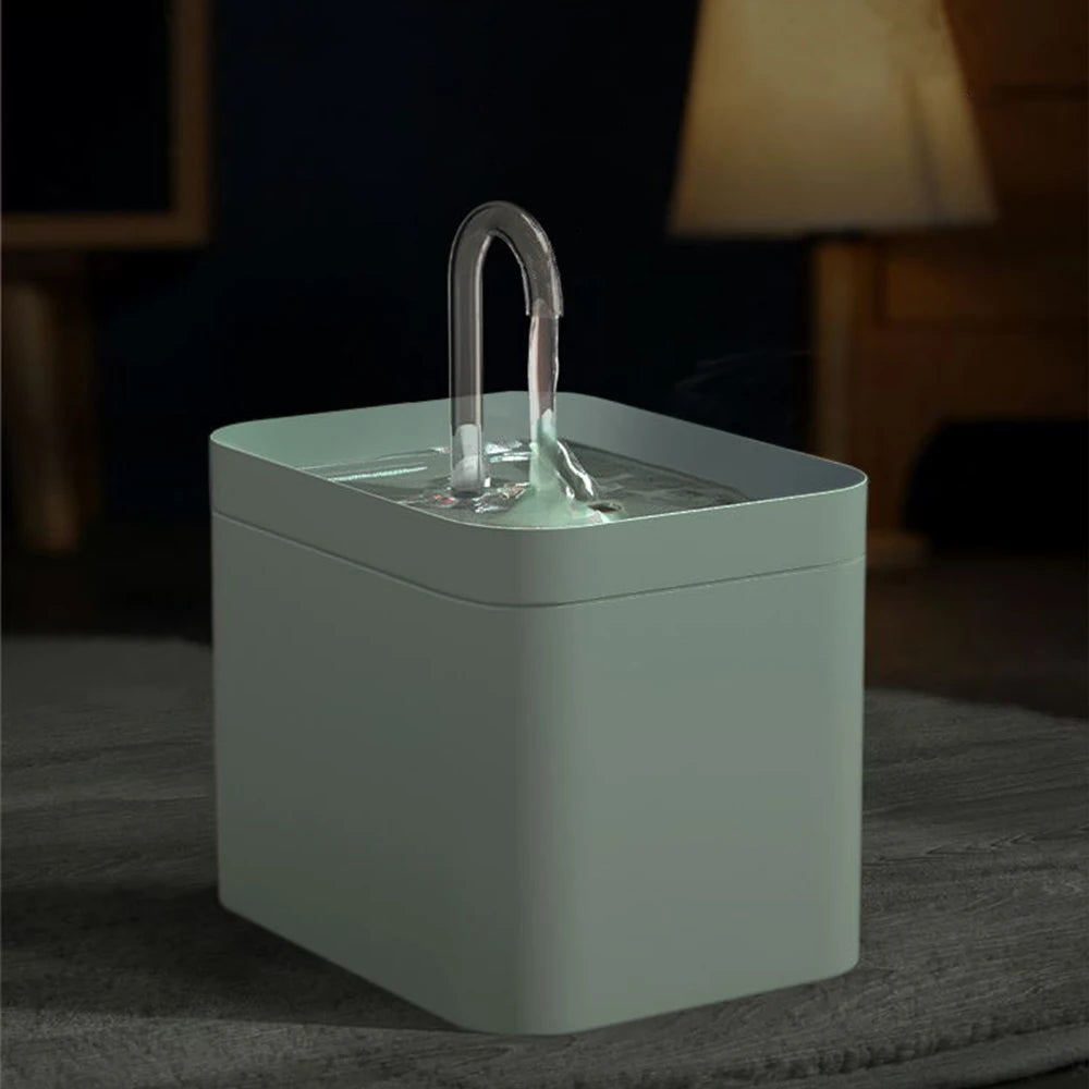 A modern water fountain with a sleek square design, dimensions labelled, showcasing a clear water stream and minimalistic style.