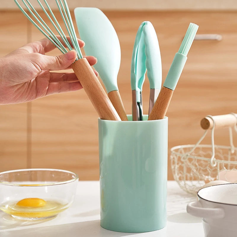 This 12-piece silicone kitchen utensil set combines high-quality, heat-resistant silicone with ergonomic wooden handles for superior comfort and grip. Designed for use with nonstick cookware, these tools prevent scratching while withstanding temperatures up to 446°F (230°C). The BPA-free, dishwasher-safe construction ensures safety and easy cleaning. Versatile and durable, this set is ideal for a wide range of cooking tasks, offering both functionality and longevity in your kitchen.