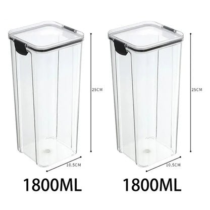 A collection of transparent storage containers filled with various dry foods like pasta, beans, nuts, and cereals on a wooden surface.