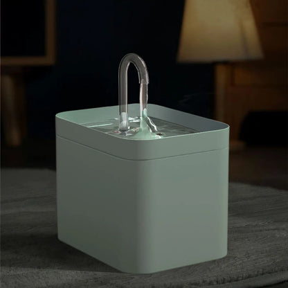 A modern water fountain with a sleek square design, dimensions labelled, showcasing a clear water stream and minimalistic style.