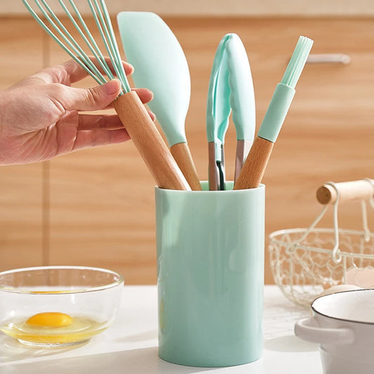 This 12-piece silicone kitchen utensil set combines high-quality, heat-resistant silicone with ergonomic wooden handles for superior comfort and grip. Designed for use with nonstick cookware, these tools prevent scratching while withstanding temperatures up to 446°F (230°C). The BPA-free, dishwasher-safe construction ensures safety and easy cleaning. Versatile and durable, this set is ideal for a wide range of cooking tasks, offering both functionality and longevity in your kitchen.